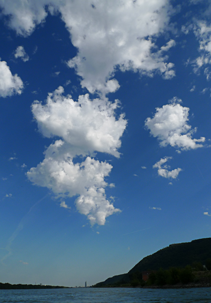 Drivin' into town with the white clouds above you ...